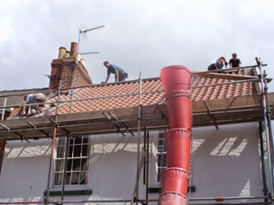 The team at work re-roofing a property