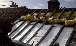 Installing roof insulation before tiling